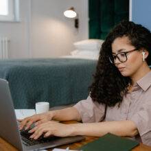 woman typing on a computer